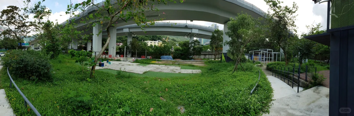 Panoramic site view beneath Sha Lek Highway with lawn and community spaces